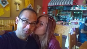 John Gamboa and his wife kiss at Suzette Crepe Cafe - Berkeley, CA