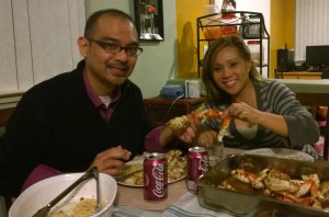John Gamboa and his wife eating Roasted Garlic Crab at home